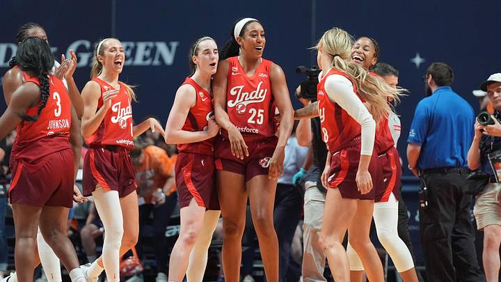 Jun 13, 2026; Uncasville, Connecticut, USA; Indiana Fever guard Caitlin Clark (22) and forward Monique Billings (25) congratulate guard Sophie Cunningham (8) for making three three-point baskets in the final minutes to help secure the victory the second half against the Connecticut Sun at Mohegan Sun Arena. Mandatory Credit: Gregory Fisher-Imagn Images