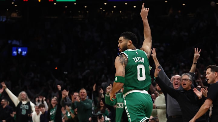 Celtics forward Jayson Tatum celebrates after making a three-pointer against the Mavericks during his first game back after tearing his Achilles 10 months ago.