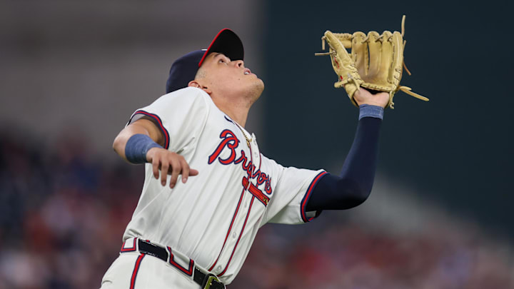 Sep 24, 2024; Atlanta, Georgia, USA; Atlanta Braves third baseman Gio Urshela (9) catches a pop fly against the New York Mets in the second inning at Truist Park. Mandatory Credit: Brett Davis-Imagn Images
