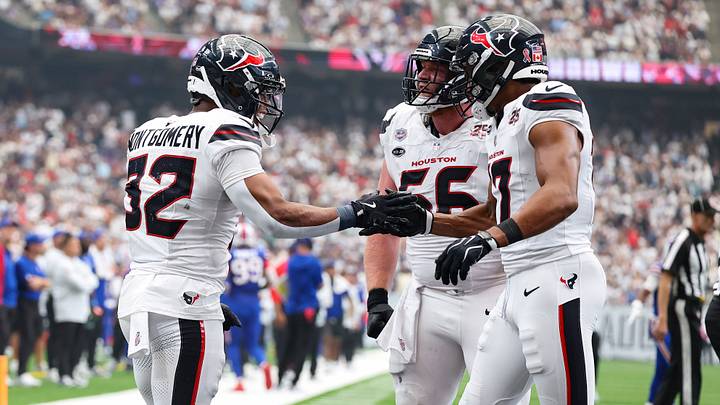 Sep 13, 2026; Houston, Texas, USA; Houston Texans running back David Montgomery (32) celebrates with wide receiver Daniel Sobkowicz (17) after scoring a touchdown during the game against the Buffalo Bills at Reliant Stadium. Mandatory Credit: Troy Taormina-Imagn Images