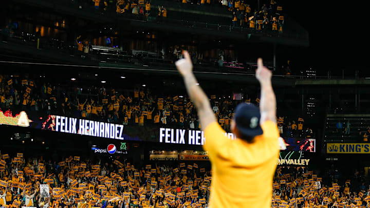 Seattle Mariners starting pitcher Felix Hernandez (34) celebrates with fans following a 3-1 loss against the Oakland Athletics at T-Mobile Park in 2019.