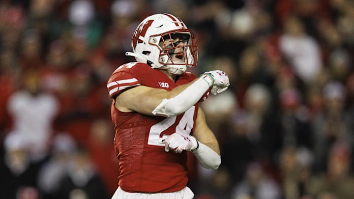 Nov 11, 2023; Madison, Wisconsin, USA;  Wisconsin Badgers safety Hunter Wohler (24) celebrates following a play during the third quarter against the Northwestern Wildcats at Camp Randall Stadium. Mandatory Credit: Jeff Hanisch-Imagn Images