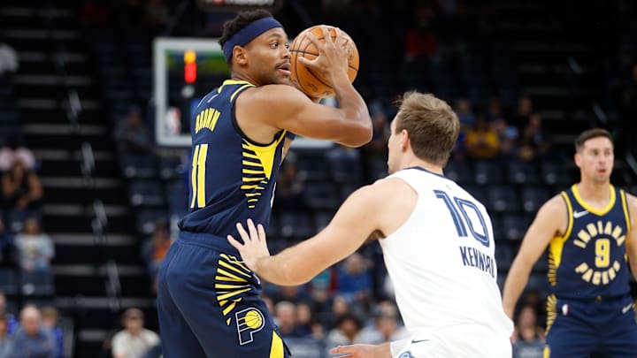 Oct 8, 2023; Memphis, Tennessee, USA; Indiana Pacers guard-forward Bruce Brown (11) handles the ball as Memphis Grizzlies guard Luke Kennard (10) defends during the first half at FedExForum. Mandatory Credit: Petre Thomas-Imagn Images