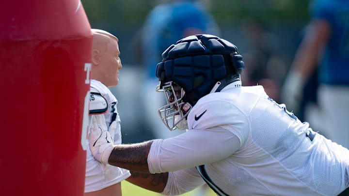 Tennessee Titans defensive lineman Keondre Coburn (91) hits the dummy during the Tennessee Titans training camp at Ascension Saint Thomas Sports Park in Nashville, Tenn., Tuesday, July 30, 2024.