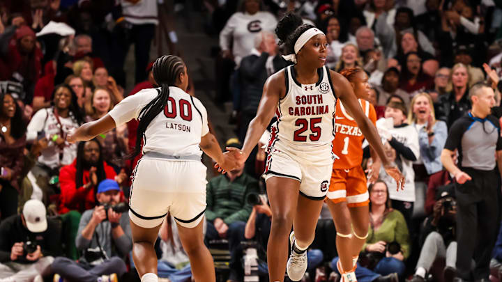 Jan 15, 2026; Columbia, South Carolina, USA; South Carolina Gamecocks guard Raven Johnson (25) and guard Ta'niya Latson (00) celebrate a play against the Texas Longhorns in the second half at Colonial Life Arena. Mandatory Credit: Jeff Blake-Imagn Images