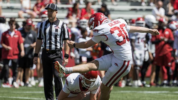 Apr 25, 2026; Fayetteville, AR, USA; Arkansas Razorbacks kicker Max Gilbert (30) kicks an extra point from holder Gavin Rush (37) during the spring game at Donald W. Reynolds Razorback Stadium. Mandatory Credit: Brett Rojo-Imagn Images Apr 25, 2026; Fayetteville, AR, USA; Arkansas Razorbacks kicker Max Gilbert (30) kicks an extra point from holder Gavin Rush (37) during the spring game at Donald W. Reynolds Razorback Stadium. Mandatory Credit: Brett Rojo-Imagn Images