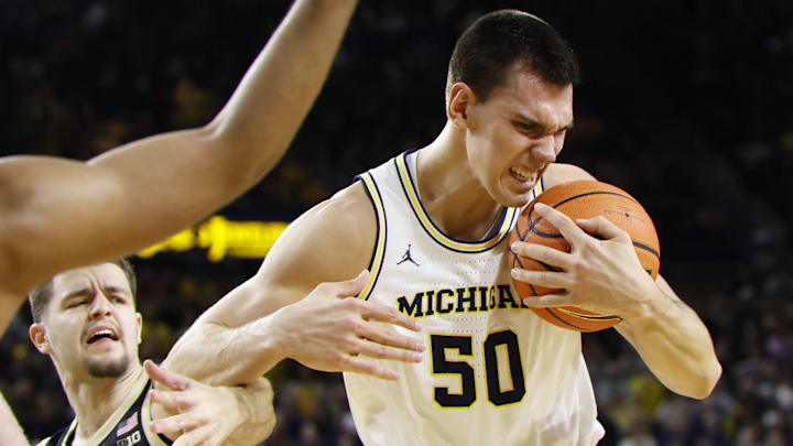 Feb 11, 2025; Ann Arbor, Michigan, USA;  Michigan Wolverines center Vladislav Goldin (50) grabs the rebound in the second half against the Purdue Boilermakers at Crisler Center. Mandatory Credit: Rick Osentoski-Imagn Images