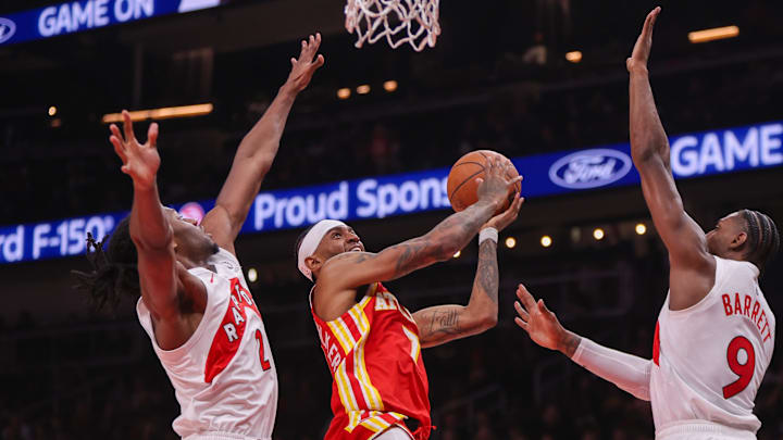 Oct 22, 2025; Atlanta, Georgia, USA; Atlanta Hawks guard Nickeil Alexander-Walker (7) shoots against the Toronto Raptors in the second quarter at State Farm Arena. Mandatory Credit: Brett Davis-Imagn Images