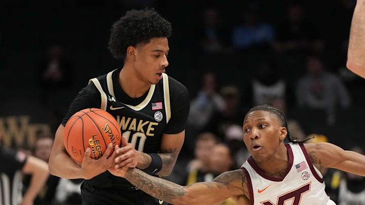 Mar 10, 2026; Charlotte, NC, USA; Wake Forest Demon Deacons guard Sebastian Akins (10) with the ball as Virginia Tech Hokies guard Ben Hammond (3) defends in the second half at Spectrum Center. Mandatory Credit: Bob Donnan-Imagn Images