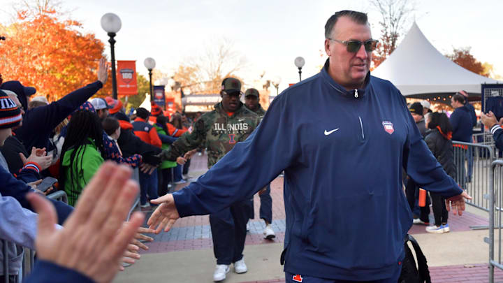 Nov 2, 2024; Champaign, Illinois, USA;  Illinois Fighting Illini head coach Bret Bielema gets a hand from the crowd before the start of a game with the Minnesota Golden Gophers at Memorial Stadium. Mandatory Credit: Ron Johnson-Imagn Images