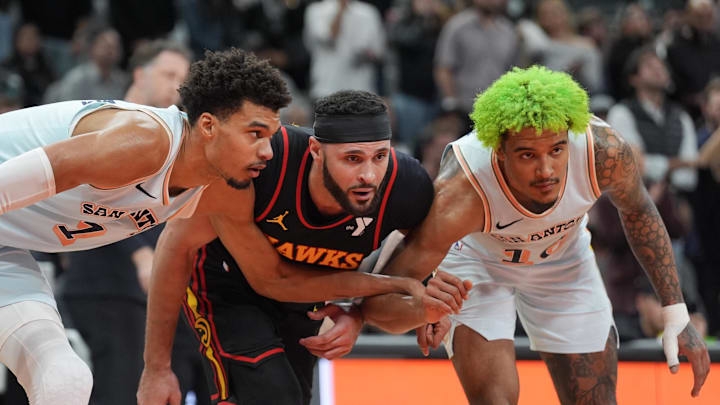 Dec 19, 2024; San Antonio, Texas, USA; San Antonio Spurs center Victor Wembanyama (1) and forward Jeremy Sochan (10) surround Atlanta Hawks forward Larry Nance Jr. (22) in the second half at Frost Bank Center. Mandatory Credit: Daniel Dunn-Imagn Images Dec 19, 2024; San Antonio, Texas, USA; San Antonio Spurs center Victor Wembanyama (1) and forward Jeremy Sochan (10) surround Atlanta Hawks forward Larry Nance Jr. (22) in the second half at Frost Bank Center. Mandatory Credit: Daniel Dunn-Imagn Images