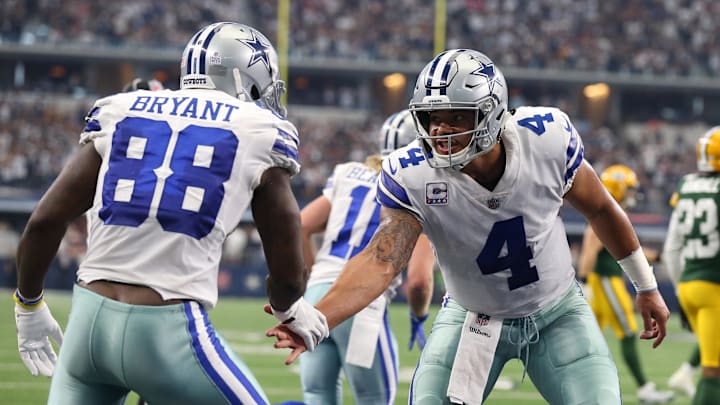 Dallas Cowboys quarterback Dak Prescott (4) celebrates a second quarter touchdown with receiver Dez Bryant.