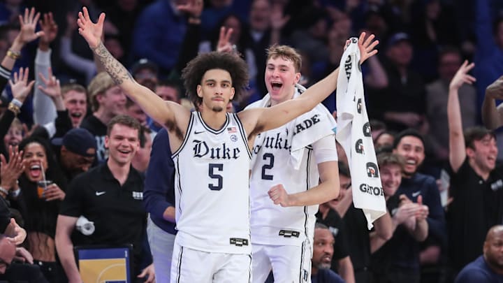 Feb 22, 2025; New York, NY, USA;  Duke Blue Devils guards Tyrese Proctor (5) and Cooper Flagg (2) celebrate from the bench in the second half against the Illinois Fighting Illini at Madison Square Garden. Mandatory Credit: Wendell Cruz-Imagn Images