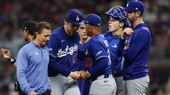 Aug 26, 2026; Cumberland, Georgia, USA;  Los Angeles Dodgers starting pitcher Roki Sasaki (11) exits the game against the Atlanta Braves in the fourth inning at Truist Park.  Mandatory Credit: Colin Hubbard-Imagn Images