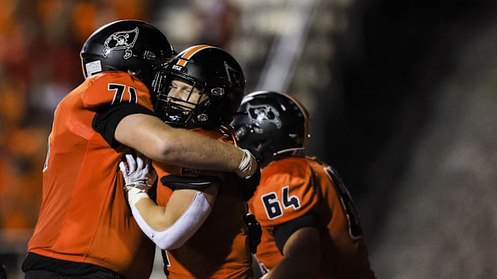 Ryle's Max Neumann (71) celebrates after Jacob Savage (21) scores a touchdown against Campbell County in the first half at Ryle High School Oct. 11, 2024.