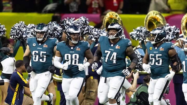 Feb 9, 2025; New Orleans, LA, USA; Philadelphia Eagles offensive tackle Lane Johnson (65), defensive end Jalen Carter (98), offensive tackle Fred Johnson (74) and defensive end Brandon Graham (55) enter the field prior to game against the Kansas City Chiefs during Super Bowl LIX at Ceasars Superdome. Mandatory Credit: Mark J. Rebilas-Imagn Images