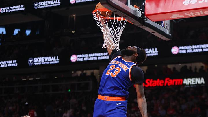 New York Knicks center Mitchell Robinson (23) dunks against the Atlanta Hawks in the second quarter during game six of the first round of the 2026 NBA Playoffs at State Farm Arena.