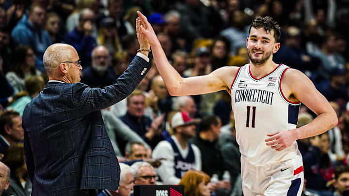 Jan 2, 2024; Storrs, Connecticut, USA; Connecticut Huskies head coach Dan Hurley congratulates forward Alex Karaban (11) coming off the court as they take on the DePaul Blue Demons at Harry A. Gampel Pavilion. Mandatory Credit: David Butler II-Imagn Images Jan 2, 2024; Storrs, Connecticut, USA; Connecticut Huskies head coach Dan Hurley congratulates forward Alex Karaban (11) coming off the court as they take on the DePaul Blue Demons at Harry A. Gampel Pavilion. Mandatory Credit: David Butler II-Imagn Images