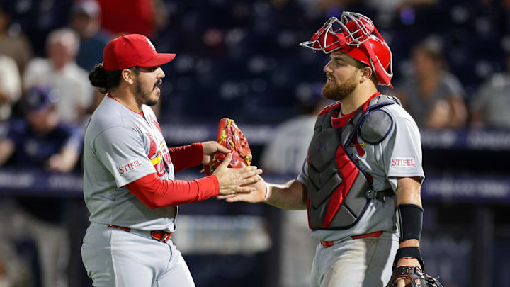 Aug 21, 2025; Tampa, Florida, USA; St. Louis Cardinals pitcher JoJo Romero (59) and catcher Pedro Pages (43) react after beating the Tampa Bay Rays at George M. Steinbrenner Field. Mandatory Credit: Nathan Ray Seebeck-Imagn Images