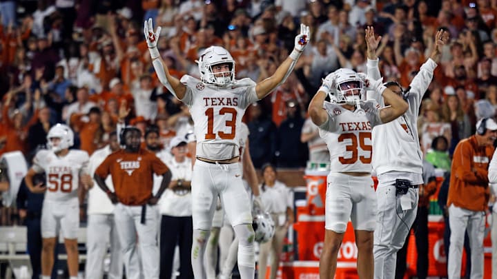 Oct 25, 2025; Starkville, Mississippi, USA; Texas Longhorns wide receiver Parker Livingstone (13) and Texas Longhorns wide receiver Rett Andersen (35) react during overtime against the Mississippi State Bulldogs at Davis Wade Stadium at Scott Field. Mandatory Credit: Petre Thomas-Imagn Images