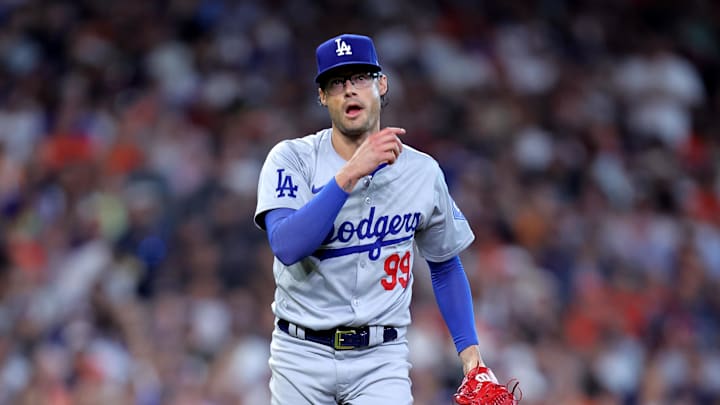 Jul 28, 2024; Houston, Texas, USA; Los Angeles Dodgers relief pitcher Joe Kelly (99) reacts after delivering a pitch against the Houston Astros during the eighth inning at Minute Maid Park. Mandatory Credit: Erik Williams-Imagn Images