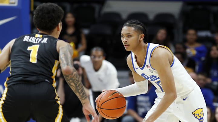 Nov 18, 2024; Pittsburgh, Pennsylvania, USA;  Pittsburgh Panthers guard Jaland Lowe (15) brings the ball up court against Virginia Military Keydets guard Rickey Bradley Jr. (1) during the first half at the Petersen Events Center. Mandatory Credit: Charles LeClaire-Imagn Images