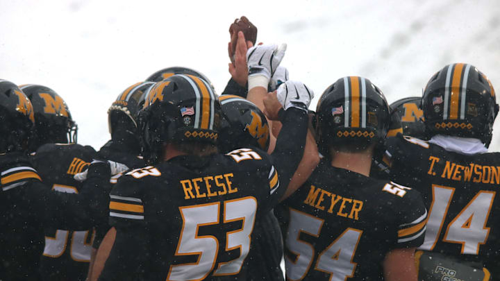 Nov 30, 2024; Columbia, Missouri, USA; Missouri Tigers huddle together and put their fists in the air prior to the final game at Faurot Field at Memorial Stadium