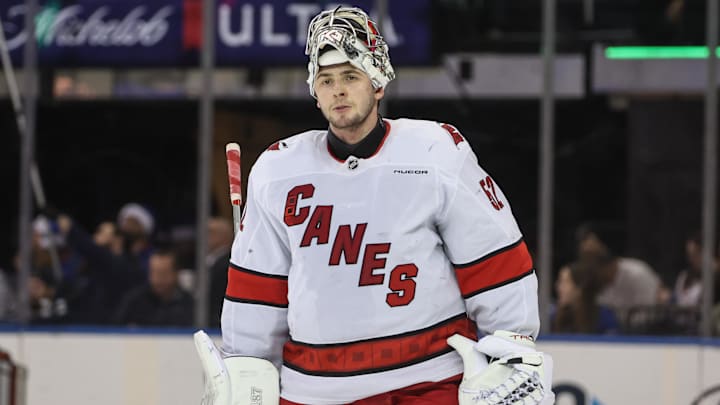 Dec 22, 2024; New York, New York, USA;  Carolina Hurricanes goaltender Pyotr Kochetkov (52) skates back to the bench during a timeout in the third period against the New York Rangers at Madison Square Garden. Mandatory Credit: Wendell Cruz-Imagn Images