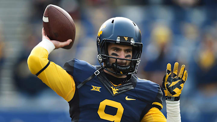 Nov 1, 2014; Morgantown, WV, USA; West Virginia Mountaineers quarterback Clint Trickett (9) warms up before the game against the TCU Horned Frogs at Milan Puskar Stadium. Mandatory Credit: Tommy Gilligan-Imagn Images Nov 1, 2014; Morgantown, WV, USA; West Virginia Mountaineers quarterback Clint Trickett (9) warms up before the game against the TCU Horned Frogs at Milan Puskar Stadium. Mandatory Credit: Tommy Gilligan-Imagn Images
