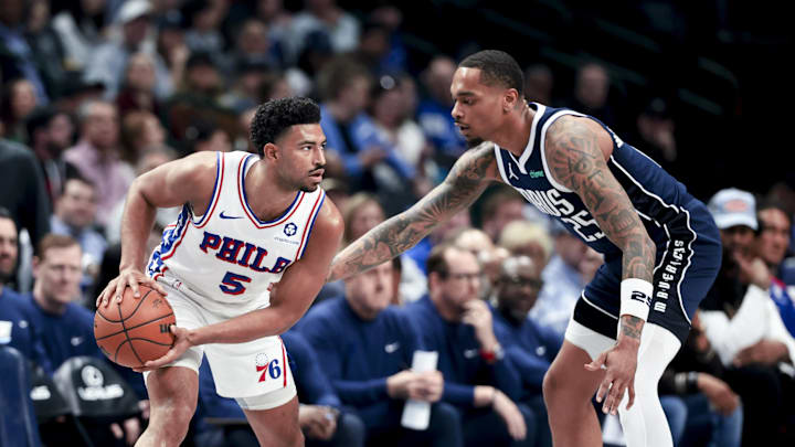 Mar 16, 2025; Dallas, Texas, USA;  Philadelphia 76ers guard Quentin Grimes (5) looks to score as Dallas Mavericks forward P.J. Washington (25) defends during the first half at American Airlines Center. Mandatory Credit: Kevin Jairaj-Imagn Images