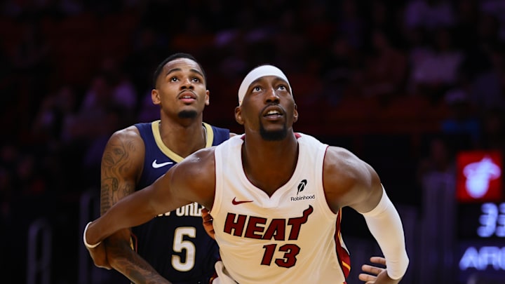 Oct 13, 2024; Miami, Florida, USA; Miami Heat center Bam Adebayo (13) defends against New Orleans Pelicans guard Dejounte Murray (5) during the second quarter at Kaseya Center. Mandatory Credit: Sam Navarro-Imagn Images