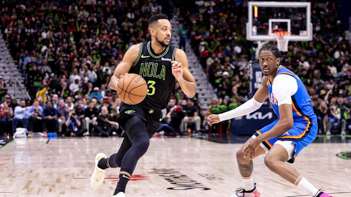 Apr 29, 2024; New Orleans, Louisiana, USA; New Orleans Pelicans guard CJ McCollum (3) dribbles against Oklahoma City Thunder forward Jalen Williams (8) during the first half of game four of the first round for the 2024 NBA playoffs at Smoothie King Center. Mandatory Credit: Stephen Lew-Imagn Images