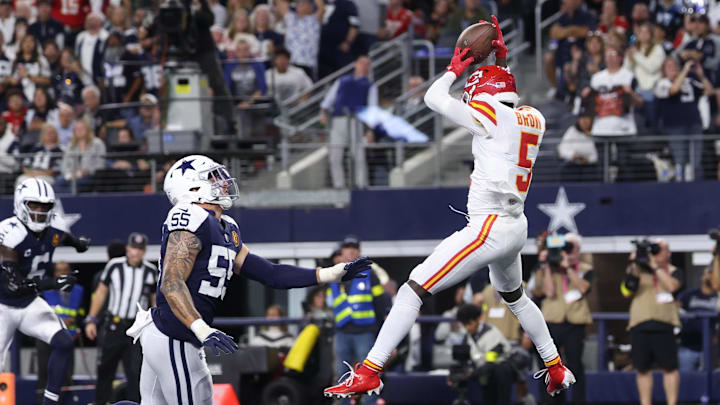 Nov 27, 2025; Arlington, Texas, USA; Kansas City Chiefs wide receiver Hollywood Brown (5) catches a pass for a touchdown against Dallas Cowboys linebacker Logan Wilson (55) during the fourth quarter at AT&T Stadium. Mandatory Credit: Kevin Jairaj-Imagn Images