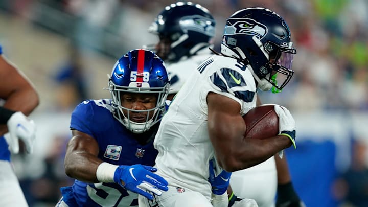 New York Giants linebacker Bobby Okereke (58) tackles Seattle Seahawks running back Kenneth Walker III (9) in the first half at MetLife Stadium on Monday, Oct. 2, 2023, in East Rutherford. New York Giants linebacker Bobby Okereke (58) tackles Seattle Seahawks running back Kenneth Walker III (9) in the first half at MetLife Stadium on Monday, Oct. 2, 2023, in East Rutherford.