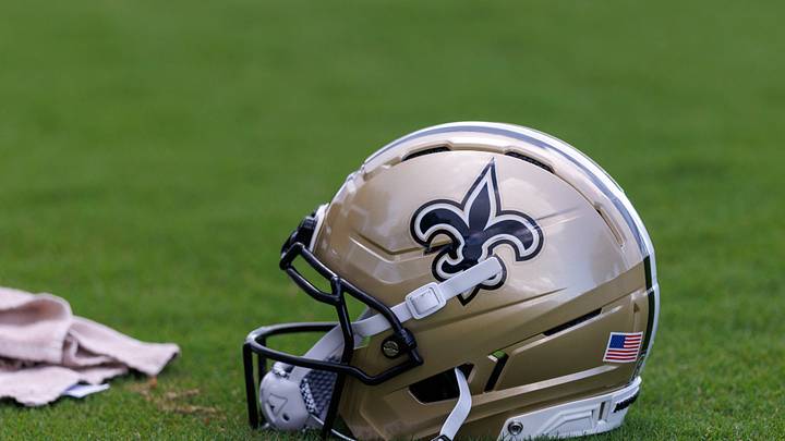 Aug 08, 2026; Metairie, LA, USA; Detailed view of the Saints NFL helmet during training camp at Ochsner Sports Performance Center. Mandatory Credit: Stephen Lew-Imagn Images Aug 08, 2026; Metairie, LA, USA; Detailed view of the Saints NFL helmet during training camp at Ochsner Sports Performance Center. Mandatory Credit: Stephen Lew-Imagn Images
