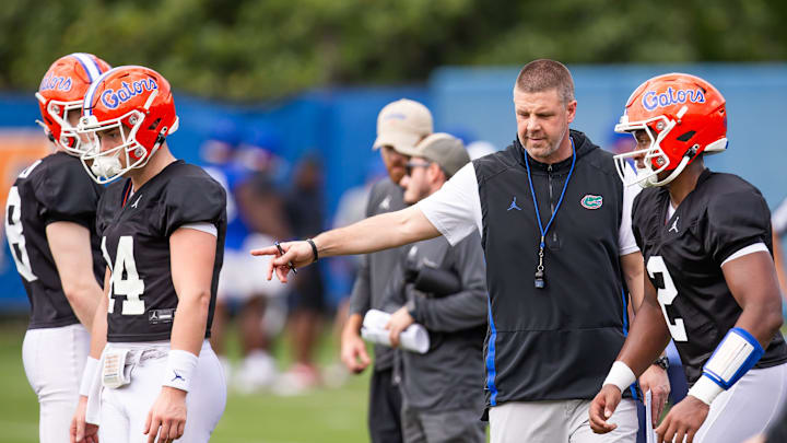 Florida quarterback DJ Lagway (2) is directed by Florida Head Coach Billy Napier watches during
