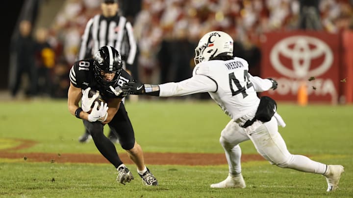 Nov 16, 2024; Ames, Iowa, USA; Iowa State Cyclones wide receiver Brett Eskildsen (81) is tackled by Cincinnati Bearcats linebacker Montay Weedon (44) at Jack Trice Stadium. The Iowa State Cyclones won the game 34-17.  Mandatory Credit: Reese Strickland-Imagn Images