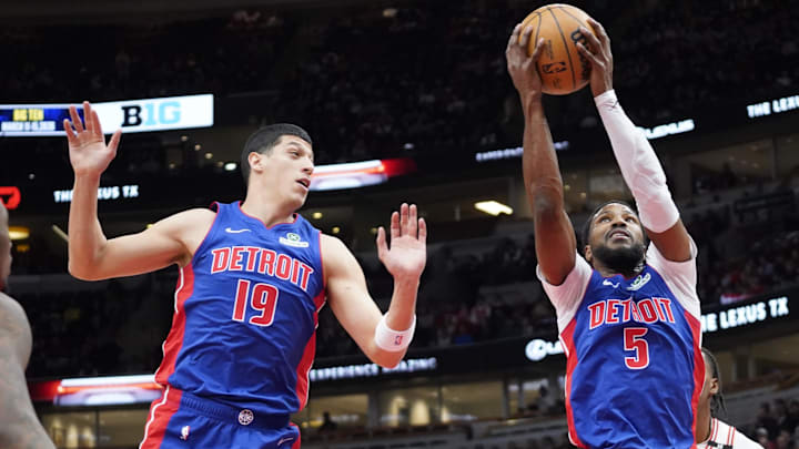 Feb 11, 2025; Chicago, Illinois, USA; Detroit Pistons guard Malik Beasley (5) and  forward Simone Fontecchio (19) go for a rebound against the Chicago Bulls during the first quarter at United Center. Mandatory Credit: David Banks-Imagn Images