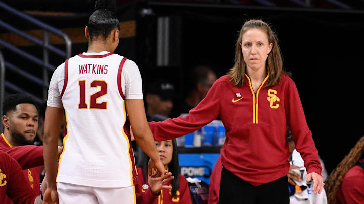 Mar 22, 2025; Los Angeles, California, USA; USC Trojans head coach Lindsay Gottlieb greets guard JuJu Watkins (12) as she comes out of the game in the fourth quarter of an NCAA Tournament game against the UNC Greensboro Spartans at Galen Center. Mandatory Credit: Robert Hanashiro-Imagn Images