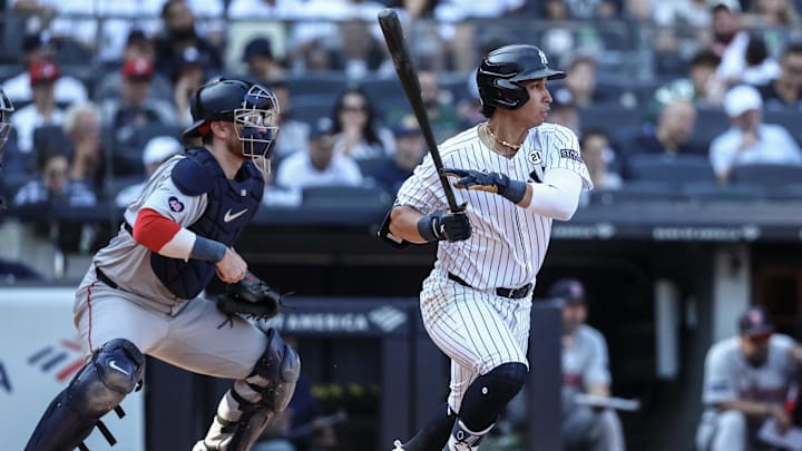Sep 15, 2024; Bronx, New York, USA;  New York Yankees first baseman Oswaldo Cabrera (95) hits a single in the eighth inning against the Boston Red Sox at Yankee Stadium. Mandatory Credit: Wendell Cruz-Imagn Images