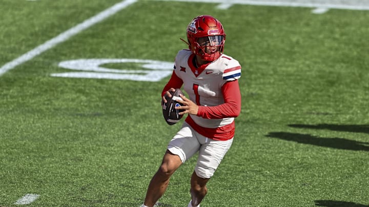 Oct 18, 2025; Houston, Texas, USA; Arizona Wildcats quarterback Noah Fifita (1) throws the ball during the first quarter against the Houston Cougars at TDECU Stadium. Mandatory Credit: Maria Lysaker-Imagn Images 