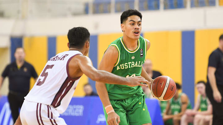 Roman Siulepa (R) of Australia Basketball team and Harsh...