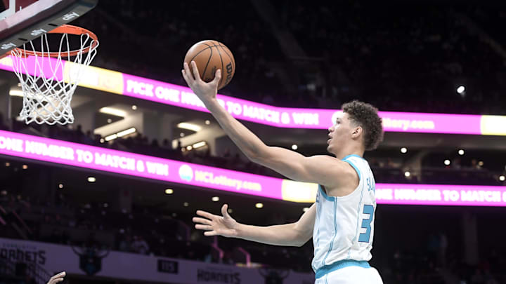 Jan 7, 2025; Charlotte, North Carolina, USA;  Charlotte Hornets forward Tidjane Salaun (31) drives in and scores during the first half against the Phoenix Suns at the Spectrum Center. Mandatory Credit: Sam Sharpe-Imagn Images