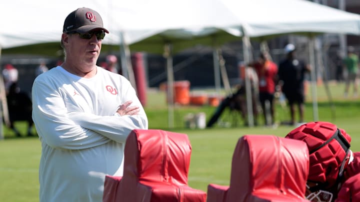 Oklahoma offensive line coach Bill Bedenbaugh watches drills during one of the Sooners' fall camp practices. Oklahoma offensive line coach Bill Bedenbaugh watches drills during one of the Sooners' fall camp practices.