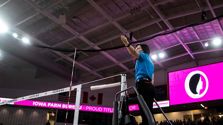 An official gestures during the Class 2A quarterfinals of the IGHSAU Girls State Volleyball Championships between Iowa City Regina Catholic and Eddyville-Blakesburg-Fremont, Tuesday, Nov. 5, 2024, at Xtream Arena in Coralville, Iowa.