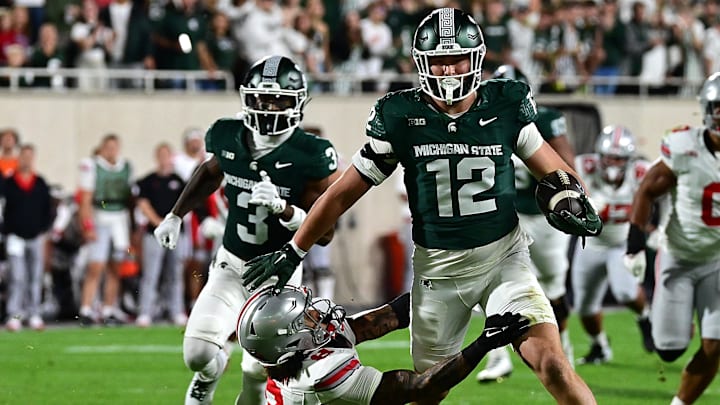 Sep 28, 2024; East Lansing, Michigan, USA;  Ohio State Buckeyes safety Lathan Ransom (8) can’t tackle Michigan State Spartans tight end Jack Velling (12) in the second quarter at Spartan Stadium. Mandatory Credit: Dale Young-Imagn Images