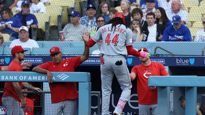 Sep 7, 2026; Los Angeles, California, USA;  Cincinnati Reds infielder Elly De La Cruz (44) celebrates with teammates and coaches in the dugout after hitting a solo home run against Los Angeles Dodgers starting pitcher Emmet Sheehan (not pictured) during the first inning at Dodger Stadium.  Mandatory Credit: Kiyoshi Mio-Imagn Images