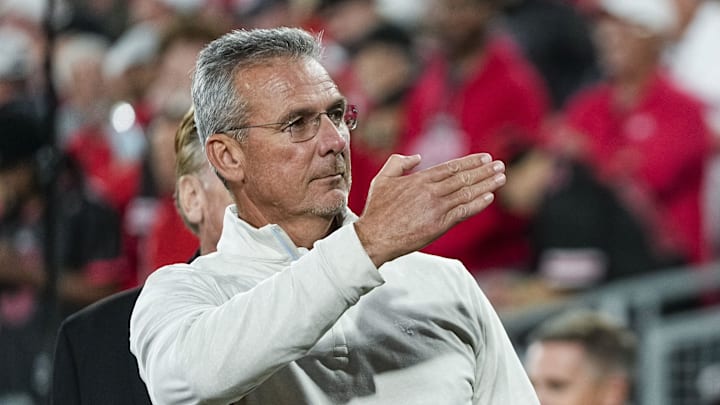 Former Ohio State Buckeyes head coach Urban Meyer salutes the fans chanting his name during the College Football Playoff quarterfinal against the Oregon Ducks at the Rose Bowl in Pasadena, Calif. on Jan. 1, 2025. Ohio State won 41-21.