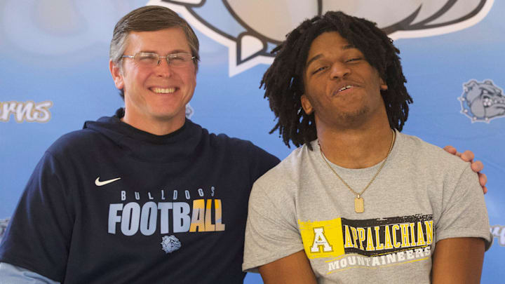 Images from early signing day for athletes at Burns, East Lincoln and South Point high schools on