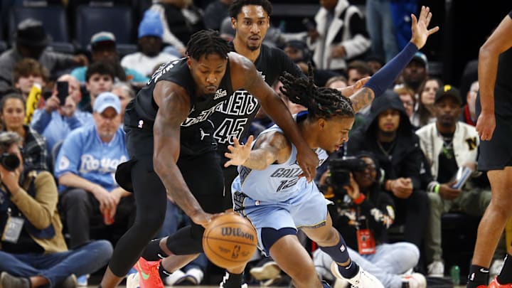 Dec 13, 2024; Memphis, Tennessee, USA; Brooklyn Nets forward Dorian Finney-Smith (28) and Memphis Grizzlies guard Ja Morant (12) battle for a loose ball during the first quarter at FedExForum. Mandatory Credit: Petre Thomas-Imagn Images Dec 13, 2024; Memphis, Tennessee, USA; Brooklyn Nets forward Dorian Finney-Smith (28) and Memphis Grizzlies guard Ja Morant (12) battle for a loose ball during the first quarter at FedExForum. Mandatory Credit: Petre Thomas-Imagn Images